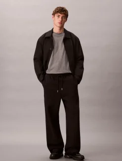 Calvin Klein Jeans miesten joggerit, LS PREMIUM TERRY CK EMBLEM JOGGER Musta