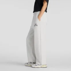 New Balance naisten collegehousut Linear Heritage Fleece Barrel Pant, vaaleanharmaa